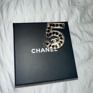CHANEL Gold-Tone Number 5 Brooch with Black Accents